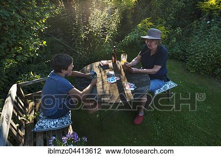 Grandmother playing cards with grandchild, Bavaria, Germany, Europe View Large Photo Image Stock Image - Grandmother playing cards with grandchild, Bavaria, Germany, Europe. Fotosearch