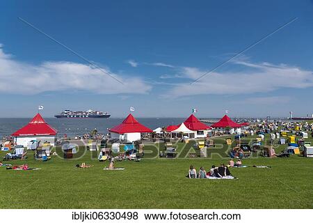 Green beach with beach chairs, Grimmershörner Bay, Cuxhaven, Lower Saxony, Germany, Europe View Large Photo Image Stock Photo - Green beach with beach chairs, Grimmershörner Bay, Cuxhaven, Lower Saxony, Germany, Europe. Fotosearch
