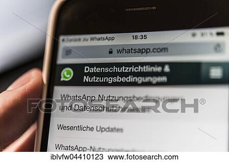 Hand holding iPhone displaying WhatsApp terms of service and privacy policy View Large Photo Image Stock Image - Hand holding iPhone displaying WhatsApp terms of service and privacy policy. Fotosearch
