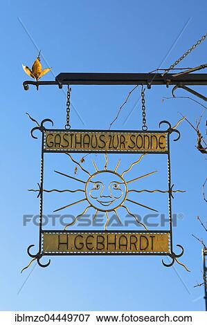 Hanging sign, Gasthaus Zur Sonne, restaurant, blue sky, Kirchehrenbach, Upper Franconia, Bavaria, Germany, Europe View Large Photo Image Stock Photo - Hanging sign, Gasthaus Zur Sonne, restaurant, blue sky, Kirchehrenbach, Upper Franconia, Bavaria, Germany, Europe. Fotosearch