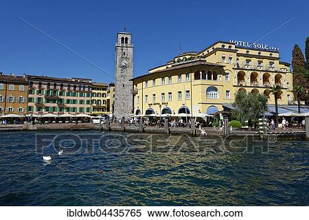 Harbour, Torre Apponale clock tower, Riva del Garda, Lake Garda, Trentino Province, Italy, Europe View Large Photo Image Stock Photography - Harbour, Torre Apponale clock tower, Riva del Garda, Lake Garda, Trentino Province, Italy, Europe. Fotosearch