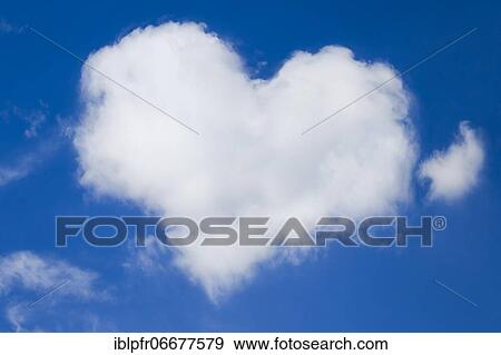 Heart shaped cloud in blue sky View Large Photo Image Stock Photo - Heart shaped cloud in blue sky. Fotosearch