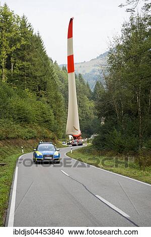 Heavy transport, wind turbine blade on heavy goods vehicle, curvy road in Schönau, Black Forest, Baden-Württemberg, Germany, Europe View Large Photo Image Stock Image - Heavy transport, wind turbine blade on heavy goods vehicle, curvy road in Schönau, Black Forest, Baden-Württemberg, Germany, Europe. Fotosearch
