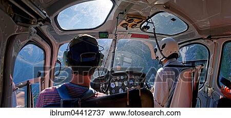 Helicopter cockpit with pilot and passenger in flight to Mount Cook, Aoraki, New Zealand Alps, South Island, New Zealand, Oceania View Large Photo Image Stock Photo - Helicopter cockpit with pilot and passenger in flight to Mount Cook, Aoraki, New Zealand Alps, South Island, New Zealand, Oceania. Fotosearch