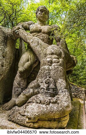 Stock Image - Hercules, Heracles fighting Cacus, Sacro Bosco, Park of the Monsters, Bormazo, Viterbo, Italy, Europe. Fotosearch