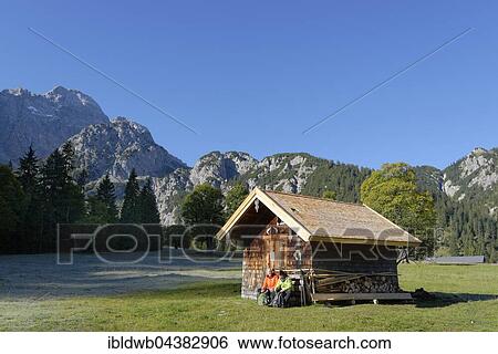 Hikers resting wooden hut, snacking, Rohntal at Pürschalm, Eng, Karwendel, Rißtal, Rissbachtal, Tyrol, Austria, Europe View Large Photo Image Stock Photograph - Hikers resting wooden hut, snacking, Rohntal at Pürschalm, Eng, Karwendel, Rißtal, Rissbachtal, Tyrol, Austria, Europe. Fotosearch