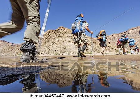 Hikers with backpacks crossing Fish River, Fish River Canyon, Namibia, Africa View Large Photo Image Stock Photo - Hikers with backpacks crossing Fish River, Fish River Canyon, Namibia, Africa. Fotosearch