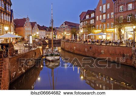 Historic houses at the Hanseatic harbour with sailing ship Willi in the evening, Old Town, Stade, Lower Saxony, Germany, Europe View Large Photo Image Stock Image - Historic houses at the Hanseatic harbour with sailing ship Willi in the evening, Old Town, Stade, Lower Saxony, Germany, Europe. Fotosearch