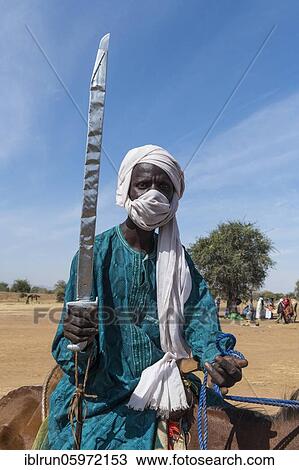 Horse rider with a sword, Sahel, Chad, Africa View Large Photo Image Stock Image - Horse rider with a sword, Sahel, Chad, Africa. Fotosearch