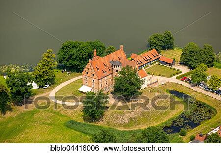 Stock Photograph - Hotel Schloss Ulrichshusen and Lake Ulrichshuser See, Schwinkendorf, Mecklenburg Lake District, Mecklenburg-Western Pomerania, Germany, Europe. Fotosearch