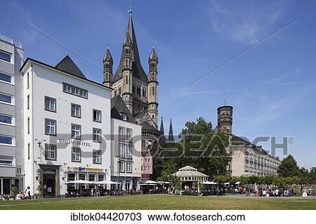 Stock Image - Houses along Rhine river bank, Great St. Martin Church behind, Cologne, North Rhine-Westphalia, Germany, Europe. Fotosearch