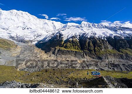 Houses of Annapurna Base Camp, glacier and the snow covered Annapurna 1 North Face, Chomrong, Kaski District, Nepal, Asia View Large Photo Image Stock Image - Houses of Annapurna Base Camp, glacier and the snow covered Annapurna 1 North Face, Chomrong, Kaski District, Nepal, Asia. Fotosearch