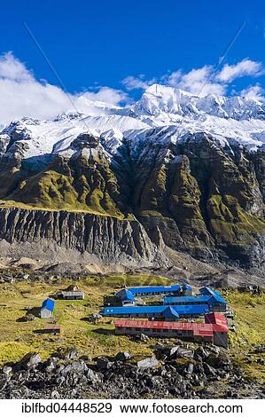 Houses of Annapurna Base Camp, glacier and the snow covered Annapurna 1 North Face, Chomrong, Kaski District, Nepal, Asia View Large Photo Image Stock Photo - Houses of Annapurna Base Camp, glacier and the snow covered Annapurna 1 North Face, Chomrong, Kaski District, Nepal, Asia. Fotosearch