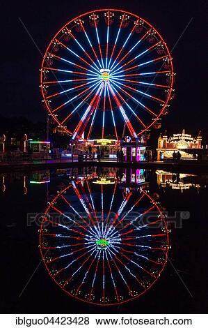 Illuminated Ferris wheel, night at Autumn Fair, Lucerne, Switzerland, Europe View Large Photo Image Stock Photo - Illuminated Ferris wheel, night at Autumn Fair, Lucerne, Switzerland, Europe. Fotosearch