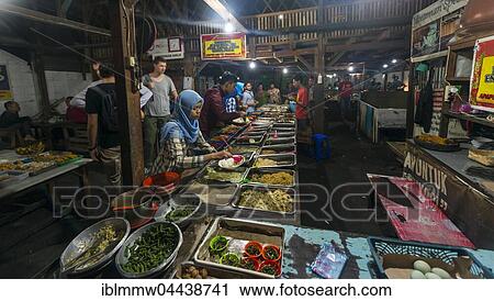 Indonesian woman taking food at booth, Food Market, Yogyakarta, Java, Indonesia, Asia View Large Photo Image Stock Image - Indonesian woman taking food at booth, Food Market, Yogyakarta, Java, Indonesia, Asia. Fotosearch