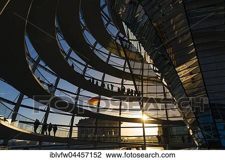 Stock Image - Interior of Reichstag dome with visitors in evening light, Reichstag, Bundestag, Berlin, Germany, Europe. Fotosearch