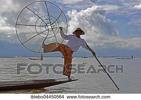 Intha fisherman, local fishing with traditional conical fishing net, Inle Lake, Myanmar, Asia View Large Photo Image Picture - Intha fisherman, local fishing with traditional conical fishing net, Inle Lake, Myanmar, Asia. Fotosearch