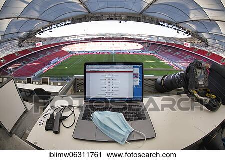 Stock Image - Journalist's seat on the grandstand, laptop with face mask, Mercedes-Benz Arena, Stuttgart, Baden-Württemberg, Germany, Europe. Fotosearch