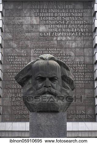 Karl-Marx-Monument in front of the State Office for Taxes and Finances at Brückenstraße in Chemnitz, 17. 10. 2020. Behind it a text board "Proletarians of all countries unite! " in several languages. Chemnitz becomes cultural capital 2025, Chemnitz View Large Photo Image Stock Photography - Karl-Marx-Monument in front of the State Office for Taxes and Finances at Brückenstraße in Chemnitz, 17. 10. 2020. Behind it a text board "Proletarians of all countries unite! " in several languages. Chemnitz becomes cultural capital 2025, Chemnitz. Fotosearch