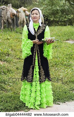 Kazakh woman meeting guests with candies, Kazakh ethnographic village aul Gunny, Talgar, Almaty, Kazakhstan, Asia View Large Photo Image Stock Image - Kazakh woman meeting guests with candies, Kazakh ethnographic village aul Gunny, Talgar, Almaty, Kazakhstan, Asia. Fotosearch