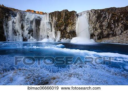 Kirkjufellsfoss waterfall in winter, Snäfellsnes peninsula, Iceland, Europe View Large Photo Image Stock Photo - Kirkjufellsfoss waterfall in winter, Snäfellsnes peninsula, Iceland, Europe. Fotosearch