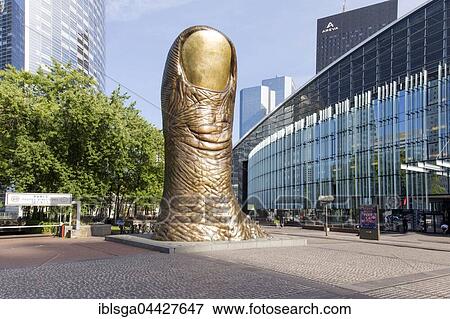 Stock Photo - Le Pouce, giant thumb sculpture, artist César Baldaccini, skyscrapers, La Defense business district, Hauts-de-Seine, Paris, France, Europe. Fotosearch
