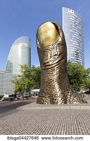 Stock Photograph - Le Pouce, giant thumb sculpture, artist César Baldaccini, skyscrapers, La Defense business district, Hauts-de-Seine, Paris, France, Europe. Fotosearch
