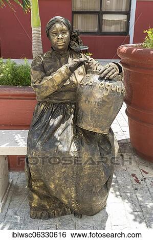 Life-size bronze statue, Cuban female figure with drum, Cienfuegos, Cuba, Central America View Large Photo Image Stock Photograph - Life-size bronze statue, Cuban female figure with drum, Cienfuegos, Cuba, Central America. Fotosearch
