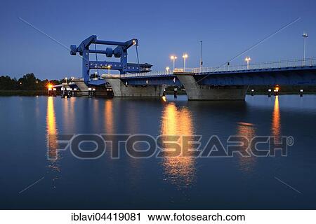 Lift bridge over Peenestrom to Usedom Island, dusk, Wolgast, Mecklenburg-Western Pomerania, Germany, Europe View Large Photo Image Stock Image - Lift bridge over Peenestrom to Usedom Island, dusk, Wolgast, Mecklenburg-Western Pomerania, Germany, Europe. Fotosearch