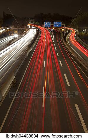 Light trails on motorway at night, Autobahn A 40, Essen, Ruhr district, North Rhine-Westphalia, Germany, Europe View Large Photo Image Picture - Light trails on motorway at night, Autobahn A 40, Essen, Ruhr district, North Rhine-Westphalia, Germany, Europe. Fotosearch
