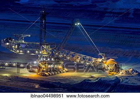 Lignite opencast mine at night, stacker, Garzweiler, North Rhine-Westphalia, Germany, Europe View Large Photo Image Stock Image - Lignite opencast mine at night, stacker, Garzweiler, North Rhine-Westphalia, Germany, Europe. Fotosearch