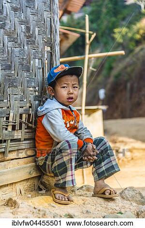 Little boy sitting in front of log cabin, Palaung hilltribe, Palaung Village in Kyaukme, Shan State, Myanmar, Asia View Large Photo Image Stock Image - Little boy sitting in front of log cabin, Palaung hilltribe, Palaung Village in Kyaukme, Shan State, Myanmar, Asia. Fotosearch
