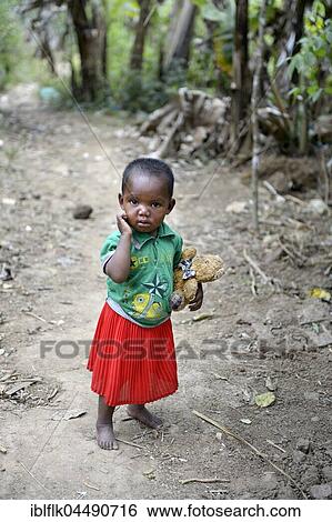 Little girl with teddy bear, Ambatomainty village, Moramanga, Alaotra-Mangoro region, Madagascar, Africa View Large Photo Image Stock Photograph - Little girl with teddy bear, Ambatomainty village, Moramanga, Alaotra-Mangoro region, Madagascar, Africa. Fotosearch