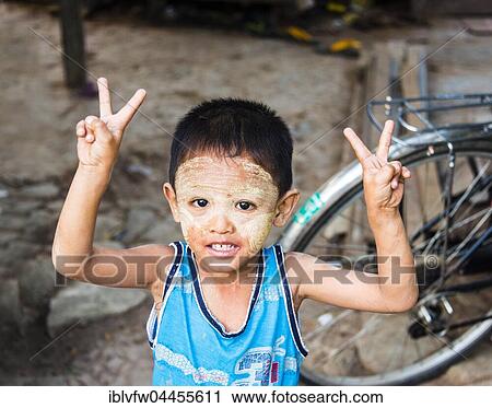 Little native boy posing, victory sign, V sign, peace, portrait, Yangon, Myanmar, Asia View Large Photo Image Stock Image - Little native boy posing, victory sign, V sign, peace, portrait, Yangon, Myanmar, Asia. Fotosearch