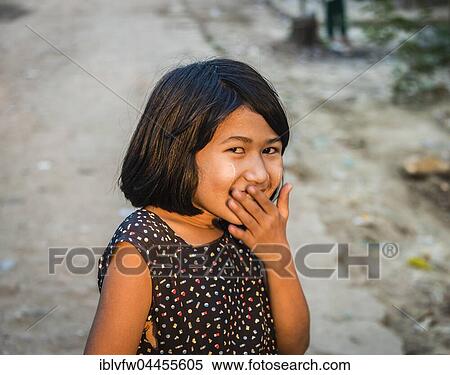 Little native girl smiling mischievously, portrait, Yangon, Myanmar, Asia View Large Photo Image Stock Photography - Little native girl smiling mischievously, portrait, Yangon, Myanmar, Asia. Fotosearch