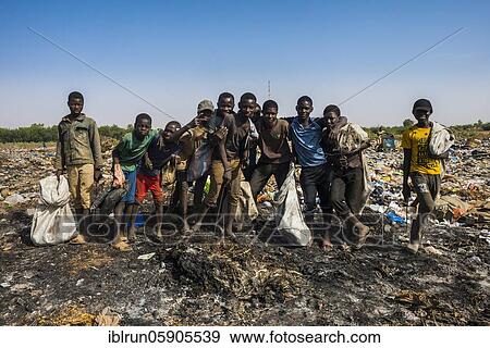 Local boys posing on a dump, Niamey, Niger, Africa View Large Photo Image Stock Photo - Local boys posing on a dump, Niamey, Niger, Africa. Fotosearch