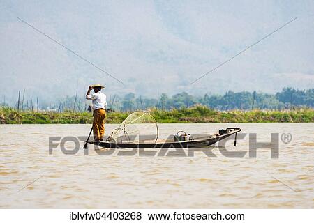 Local fisherman on wooden boat, Inle Lake, Shan State, Myanmar, Asia View Large Photo Image Stock Photo - Local fisherman on wooden boat, Inle Lake, Shan State, Myanmar, Asia. Fotosearch