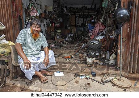 Local, Sinhalese man sitting in front of his garage, Beruwela, Western Province, Sri Lanka, Asia View Large Photo Image Stock Image - Local, Sinhalese man sitting in front of his garage, Beruwela, Western Province, Sri Lanka, Asia. Fotosearch