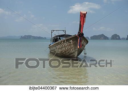 Longtail boat on Tubkaek beach, Krabi Province, Thailand, Asia View Large Photo Image Stock Photo - Longtail boat on Tubkaek beach, Krabi Province, Thailand, Asia. Fotosearch