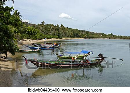 Stock Image - Longtail fishing boats, Thong Tanod Pier, Taling Ngam Beach, Koh Samui, Thailand, Asia. Fotosearch
