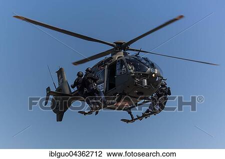 Lucerne police, Luchs special unit doing helicopter exercise, EC 635, rescue team abseiling, Switzerland, Europe View Large Photo Image Stock Image - Lucerne police, Luchs special unit doing helicopter exercise, EC 635, rescue team abseiling, Switzerland, Europe. Fotosearch