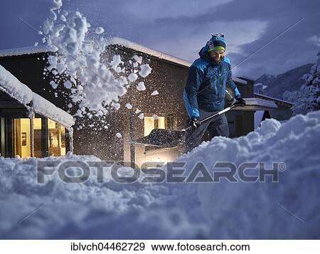 Man, 35-40 years, shoveling snow at dusk, Kolsass, Tyrol, Austria, Europe View Large Photo Image Stock Photo - Man, 35-40 years, shoveling snow at dusk, Kolsass, Tyrol, Austria, Europe. Fotosearch