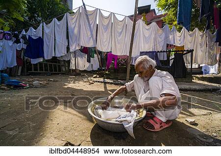Man doing laundry by hand in courtyard, Kathmandu, Kathmandu District, Nepal, Asia View Large Photo Image Picture - Man doing laundry by hand in courtyard, Kathmandu, Kathmandu District, Nepal, Asia. Fotosearch