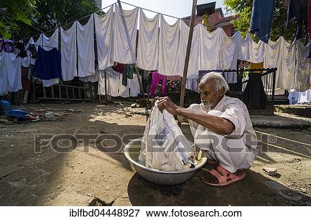 Man doing laundry by hand in courtyard, Kathmandu, Kathmandu District, Nepal, Asia View Large Photo Image Stock Photo - Man doing laundry by hand in courtyard, Kathmandu, Kathmandu District, Nepal, Asia. Fotosearch