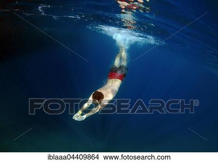 Man swims underwater in clear blue water, sea, Aegean Sea, Turkey, Asia View Large Photo Image Picture - Man swims underwater in clear blue water, sea, Aegean Sea, Turkey, Asia. Fotosearch
