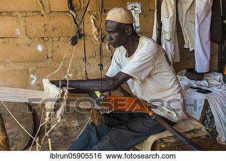 Man waiving on a traditional loom, National museum, Niamey, Niger, Africa View Large Photo Image Stock Photograph - Man waiving on a traditional loom, National museum, Niamey, Niger, Africa. Fotosearch