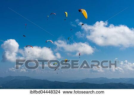 Many paragliders are flying over Pokhara and Phewa Lake, Sarangkot, Kaski District, Nepal, Asia View Large Photo Image Picture - Many paragliders are flying over Pokhara and Phewa Lake, Sarangkot, Kaski District, Nepal, Asia. Fotosearch