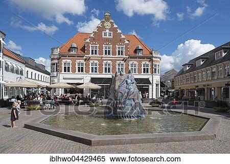 Stock Photography - Market square, fountain sculpture of St. George and The Dragon, 1986, by Sten Lykke Madsen, Holstebro, Midtjylland, Denmark, Europe. Fotosearch