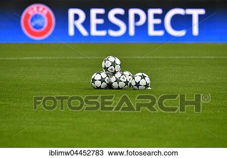 Stock Image - Match balls with Champions League Logo in front of UEFA perimeter advertisement, RESPECT, Allianz Arena, Munich, Bavaria, Germany, Europe. Fotosearch
