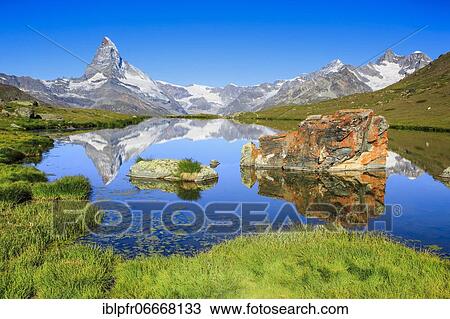 Stock Image - Matterhorn and mountain lake, Valais, Switzerland, Europe. Fotosearch